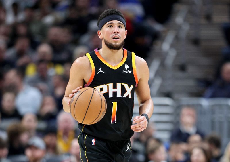 INDIANAPOLIS, INDIANA - JANUARY 26: Devin Booker #1 of the Phoenix Suns dribbles the ball against the Indiana Pacers during the first half at Gainbridge Fieldhouse on January 26, 2024 in Indianapolis, Indiana.    NOTE TO USER: User expressly acknowledges and agrees that, by downloading and or using this photograph, User is consenting to the terms and conditions of the Getty Images License Agreement.  (Photo by Andy Lyons/Getty Images)