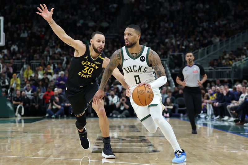 MILWAUKEE, WISCONSIN - FEBRUARY 10: Damian Lillard #0 of the Milwaukee Bucks is defended by Stephen Curry #30 of the Golden State Warriors during the second half of a game at Fiserv Forum on February 10, 2025 in Milwaukee, Wisconsin. NOTE TO USER: User expressly acknowledges and agrees that, by downloading and or using this photograph, User is consenting to the terms and conditions of the Getty Images License Agreement. (Photo by Stacy Revere/Getty Images)