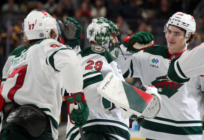 Oct 29, 2024; Pittsburgh, Pennsylvania, USA; Minnesota Wild goaltender Marc-Andre Fleury (29) is congratulated by teammates after taking a victory lap in honor of his last game in Pittsburgh and defeating the Pittsburgh Penguins at PPG Paints Arena. Fleury began his career with the Penguins earning three Stanley Cups in Pittsburgh. Mandatory Credit: Charles LeClaire-Imagn Images