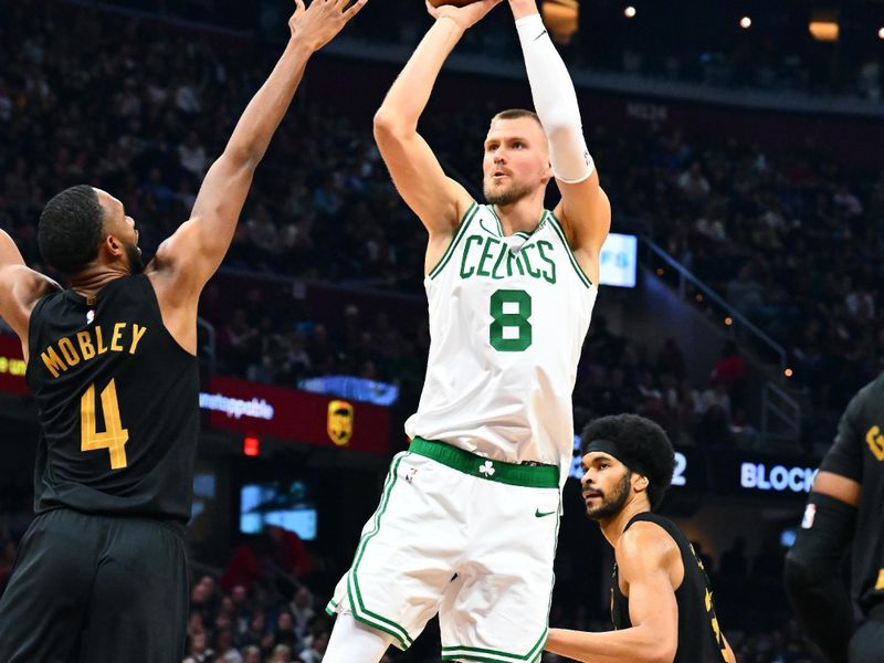 CLEVELAND, OHIO - MARCH 05: Kristaps Porzingis #8 of the Boston Celtics shoots over Evan Mobley #4 of the Cleveland Cavaliers during the second quarter at Rocket Mortgage Fieldhouse on March 05, 2024 in Cleveland, Ohio. NOTE TO USER: User expressly acknowledges and agrees that, by downloading and or using this photograph, User is consenting to the terms and conditions of the Getty Images License Agreement. (Photo by Jason Miller/Getty Images)