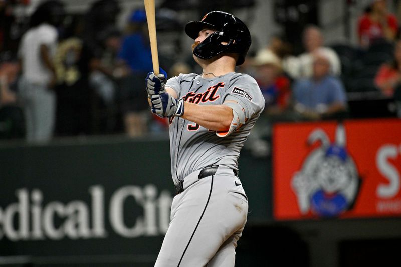 Jun 3, 2024; Arlington, Texas, USA; Detroit Tigers catcher Jake Rogers (34) hits the game winning home run against the Texas Rangers during the eighth inning at Globe Life Field. Mandatory Credit: Jerome Miron-USA TODAY Sports