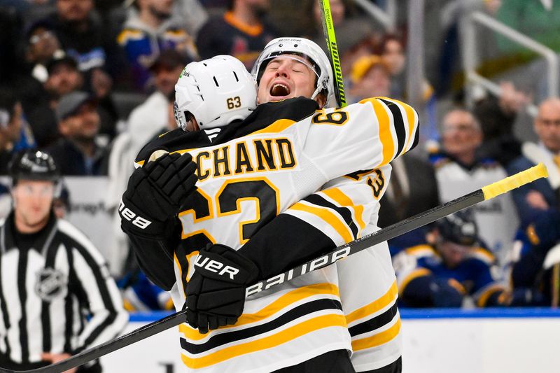 Nov 12, 2024; St. Louis, Missouri, USA;  Boston Bruins defenseman Charlie McAvoy (73) celebrates with left wing Brad Marchand (63) after scoring the game tying goal against the St. Louis Blues during the third period at Enterprise Center. Mandatory Credit: Jeff Curry-Imagn Images