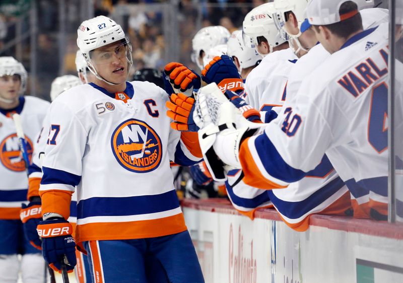 Mar 9, 2023; Pittsburgh, Pennsylvania, USA;  New York Islanders left wing Anders Lee (27) celebrates his goal with the New York bench against the Pittsburgh Penguins during the first period at PPG Paints Arena. Mandatory Credit: Charles LeClaire-USA TODAY Sports