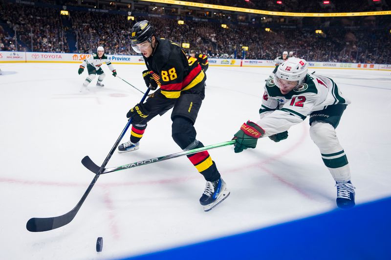 Dec 7, 2023; Vancouver, British Columbia, CAN; Minnesota Wild forward Matt Boldy (12) stick checks Vancouver Canucks forward Nils Aman (88) in the third period at Rogers Arena. Vancouver won 2-0.  Mandatory Credit: Bob Frid-USA TODAY Sports