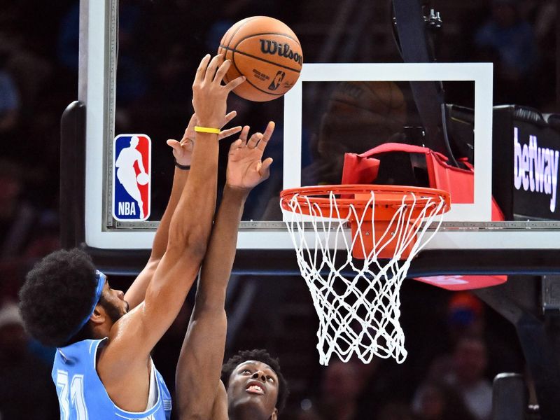 CLEVELAND, OHIO - NOVEMBER 17: Jarrett Allen #31 of the Cleveland Cavaliers shoots over Moussa Diabate #14 of the Charlotte Hornets during the first quarter at Rocket Mortgage Fieldhouse on November 17, 2024 in Cleveland, Ohio. NOTE TO USER: User expressly acknowledges and agrees that, by downloading and or using this photograph, User is consenting to the terms and conditions of the Getty Images License Agreement. (Photo by Jason Miller/Getty Images)