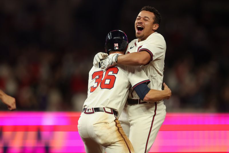 May 8, 2025; Atlanta, Georgia, USA; Atlanta Braves catcher Drake Baldwin (30) celebrates after a walk-off single with right fielder Eli White (36) against the Cincinnati Reds in the eleventh inning at Truist Park. Mandatory Credit: Brett Davis-Imagn Images
