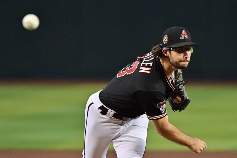 Jul 26, 2023; Phoenix, Arizona, USA;  Arizona Diamondbacks starting pitcher Zac Gallen (23) throws in the second inning against the St. Louis Cardinals at Chase Field. Mandatory Credit: Matt Kartozian-USA TODAY Sports