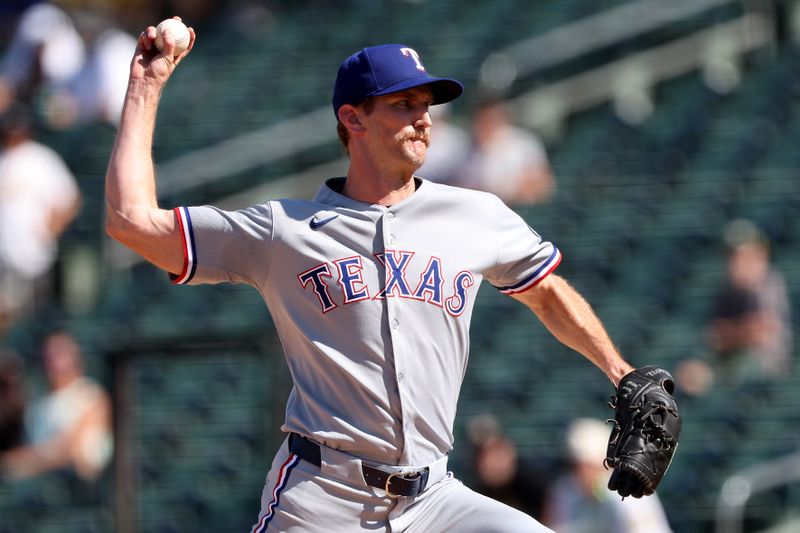 Aug 31, 2025; West Sacramento, California, USA; Texas Rangers pitcher Caleb Boushley (70) throws a pitch against the Athletics during the eighth inning at Sutter Health Park. Mandatory Credit: Dennis Lee-Imagn Images