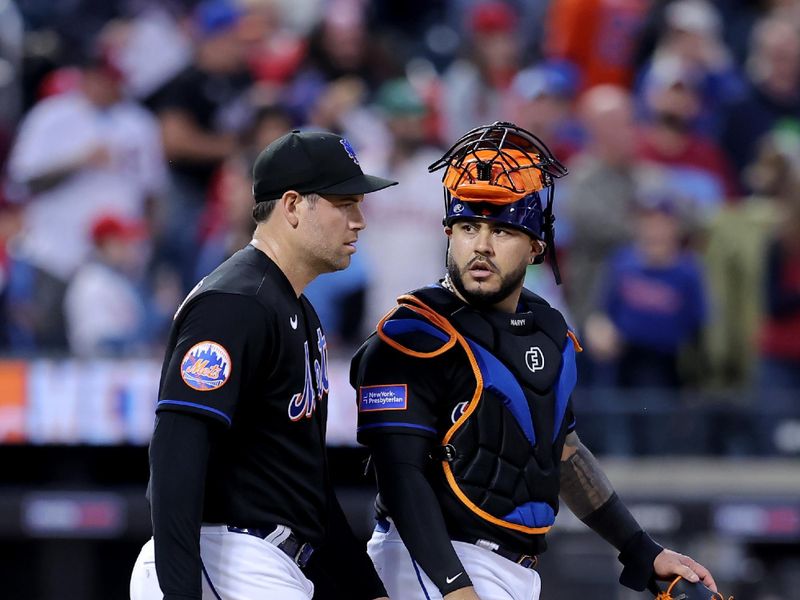 Sep 30, 2023; New York City, New York, USA; New York Mets catcher Omar Narvaez (2) talks to relief pitcher Adam Ottavino (0) after defeating the Philadelphia Phillies at Citi Field. Mandatory Credit: Brad Penner-USA TODAY Sports