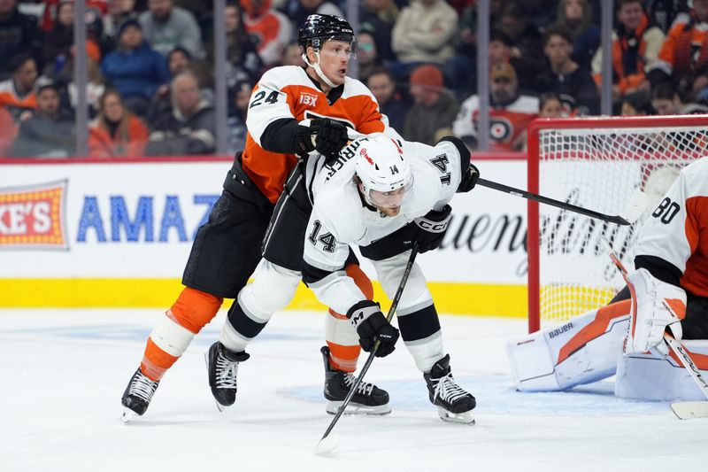 Jan 31, 2026; Philadelphia, Pennsylvania, USA; Philadelphia Flyers defenseman Nick Seeler (24) hits Los Angeles Kings right wing Alex Laferriere (14) in the third period at Xfinity Mobile Arena. Mandatory Credit: Kyle Ross-Imagn Images