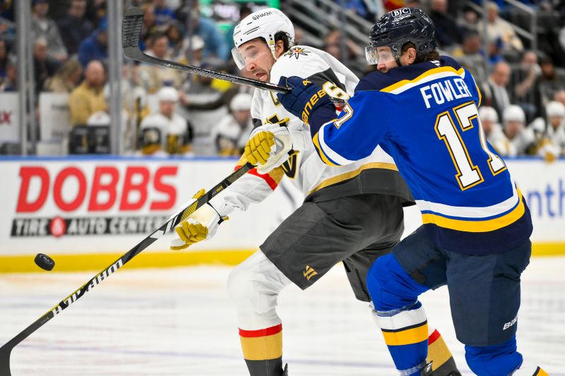 Jan 23, 2025; St. Louis, Missouri, USA;  Vegas Golden Knights right wing Mark Stone (61) steals the puck from St. Louis Blues defenseman Cam Fowler (17) during the first period at Enterprise Center. Mandatory Credit: Jeff Curry-Imagn Images