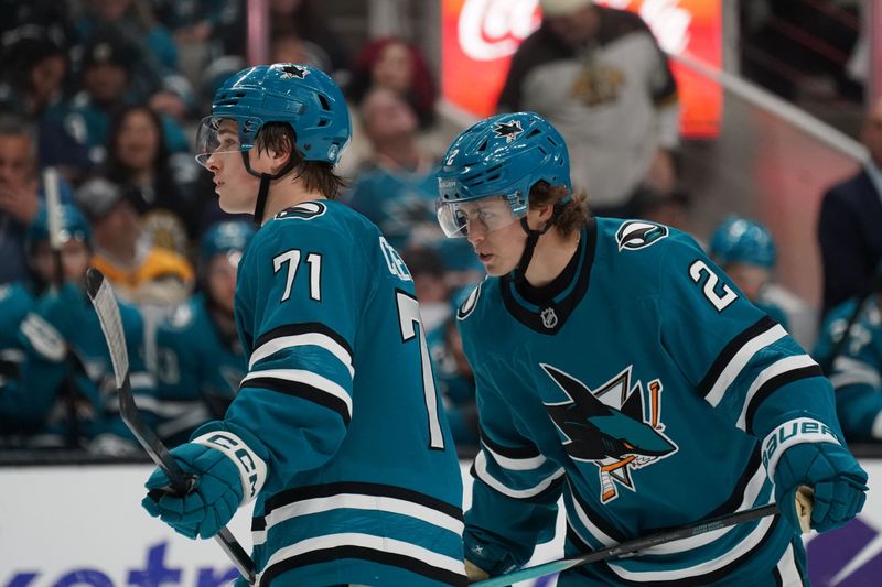Nov 23, 2025; San Jose, California, USA;  San Jose Sharks center Macklin Celebrini (71) and center Will Smith (2) talk before play resumes against the Boston Bruins in the second period at SAP Center in San Jose. Mandatory Credit: David Gonzales-Imagn Images