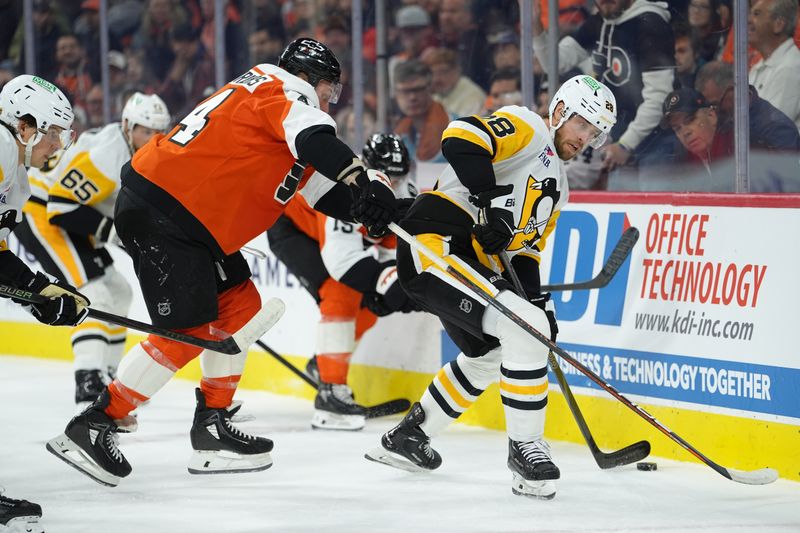 Oct 28, 2025; Philadelphia, Pennsylvania, USA; Pittsburgh Penguins defenseman Parker Wotherspoon (28) battle for the puck against Philadelphia Flyers left wing Nicolas Deslauriers (44) in the first period at Xfinity Mobile Arena. Mandatory Credit: Kyle Ross-Imagn Images