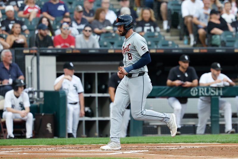 Aug 24, 2024; Chicago, Illinois, USA; Detroit Tigers outfielder Matt Vierling (8) scores against the Chicago White Sox during the first inning at Guaranteed Rate Field. Mandatory Credit: Kamil Krzaczynski-USA TODAY Sports