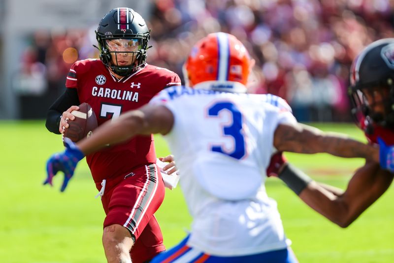 Oct 14, 2023; Columbia, South Carolina, USA; South Carolina Gamecocks quarterback Spencer Rattler (7) scrambles against the Florida Gators in the first quarter at Williams-Brice Stadium. Mandatory Credit: Jeff Blake-USA TODAY Sports