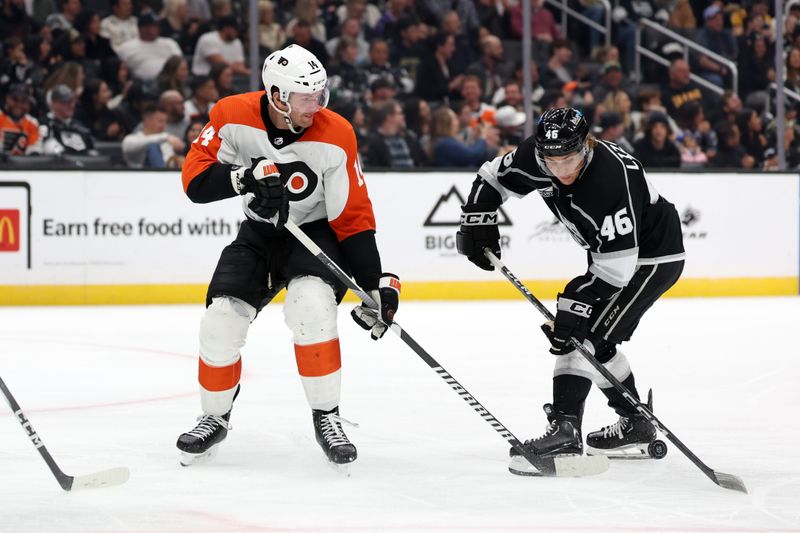 Nov 11, 2023; Los Angeles, California, USA;  Philadelphia Flyers center Sean Couturier (14) and Los Angeles Kings center Blake Lizotte (46) battle for the puck during the third period at Crypto.com Arena. Mandatory Credit: Kiyoshi Mio-USA TODAY Sports