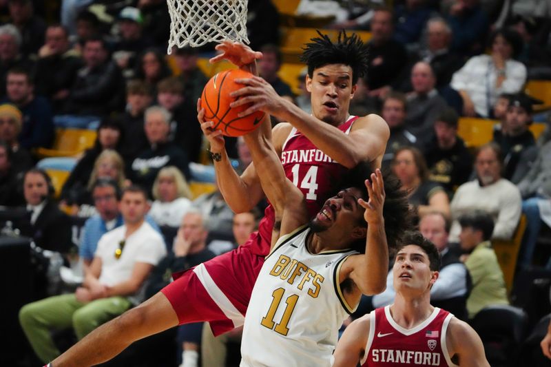 Feb 5, 2023; Boulder, Colorado, USA; Stanford Cardinal forward Spencer Jones (14) and Colorado Buffaloes guard Javon Ruffin (11) reach for rebound in the first half at the CU Events Center. Mandatory Credit: Ron Chenoy-USA TODAY Sports