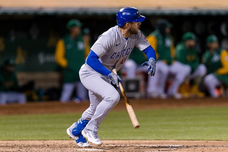 Apr 18, 2023; Oakland, California, USA; Chicago Cubs third baseman Patrick Wisdom (16) hits a single against the Oakland Athletics during the eighth inning at RingCentral Coliseum. Mandatory Credit: John Hefti-USA TODAY Sports