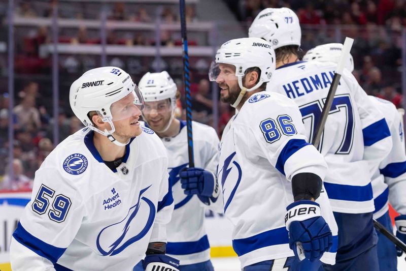 Oct 19, 2024; Ottawa, Ontario, CAN; Tampa Bay Lightning center Jake Guentzel (59) celebrates his goal scored in the second period against the Ottawa Senators at the Canadian Tire Centre. Mandatory Credit: Marc DesRosiers-Imagn Images