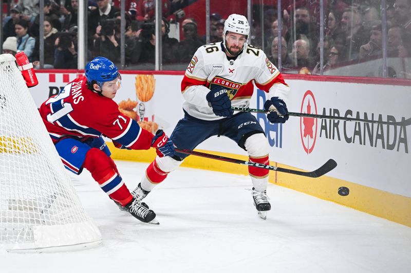 Mar 15, 2025; Montreal, Quebec, CAN; Montreal Canadiens center Jake Evans (71) defends the puck against Florida Panthers defenseman Uvis Balinskis (26) in the first period at Bell Centre. Mandatory Credit: David Kirouac-Imagn Images