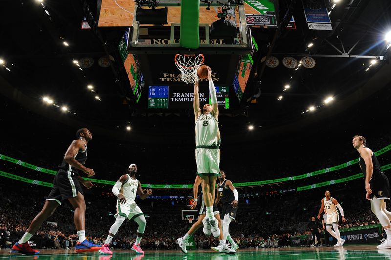 BOSTON, MA - FEBRUARY 4: Kristaps Porzingis #8 of the Boston Celtics drives to the basket during the game  against the Memphis Grizzlies  on February 4, 2024 at the TD Garden in Boston, Massachusetts. NOTE TO USER: User expressly acknowledges and agrees that, by downloading and or using this photograph, User is consenting to the terms and conditions of the Getty Images License Agreement. Mandatory Copyright Notice: Copyright 2024 NBAE  (Photo by Brian Babineau/NBAE via Getty Images)