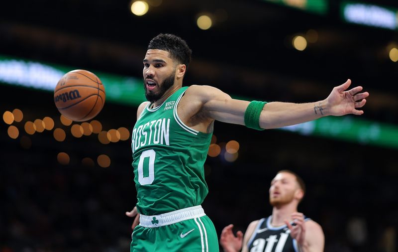 ATLANTA, GEORGIA - MARCH 25:  Jayson Tatum #0 of the Boston Celtics dunks against the Atlanta Hawks during the second quarter at State Farm Arena on March 25, 2024 in Atlanta, Georgia.  NOTE TO USER: User expressly acknowledges and agrees that, by downloading and/or using this photograph, user is consenting to the terms and conditions of the Getty Images License Agreement. (Photo by Kevin C. Cox/Getty Images)