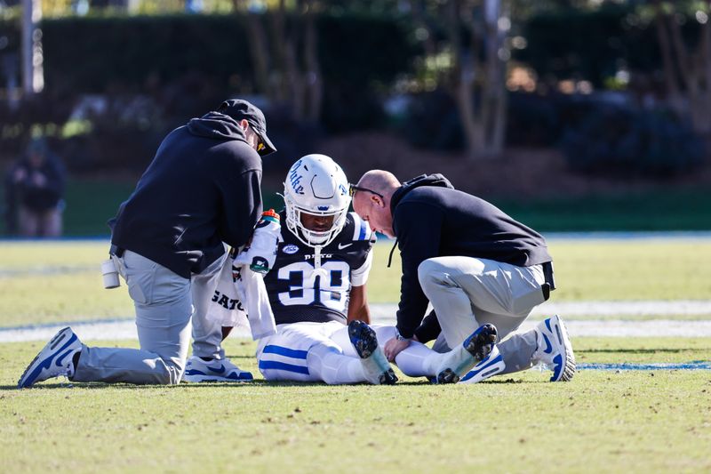 Nov 25, 2023; Durham, North Carolina, USA; Duke Blue Devils linebacker Memorable Factor (38) receives treatment during the second half of the game against Pittsburgh Panthers at Wallace Wade Stadium.  Mandatory Credit: Jaylynn Nash-USA TODAY Sports