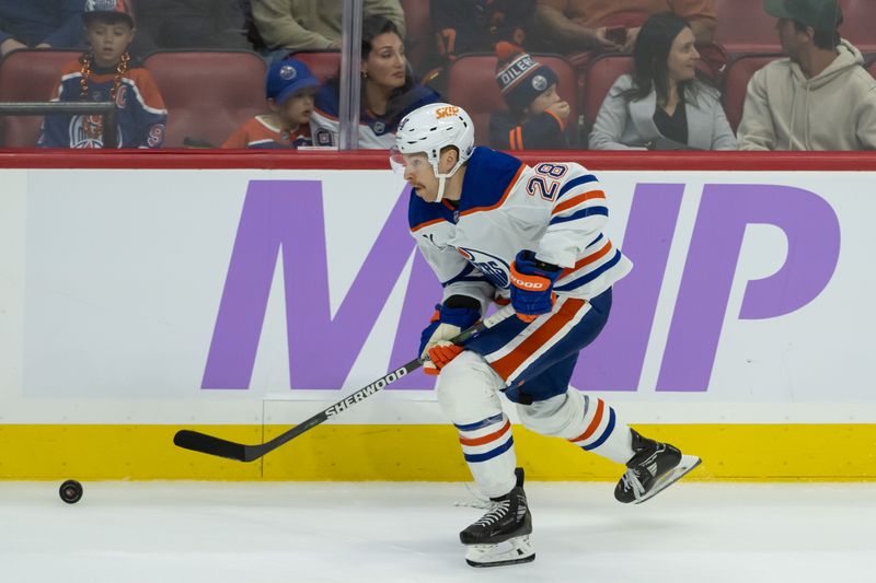 Nov 19, 2024; Ottawa, Ontario, CAN; Edmonton Oilers right wing Connor Brown (28) skates with the puck in the third period against the Ottawa Senators at the Canadian Tire Centre. Mandatory Credit: Marc DesRosiers-Imagn Images