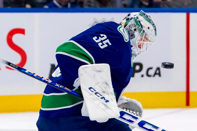 Apr 16, 2024; Vancouver, British Columbia, CAN;  Vancouver Canucks goalie Thatcher Demko (35) makes a save against the Calgary Flames in the second period at Rogers Arena. Mandatory Credit: Bob Frid-USA TODAY Sports