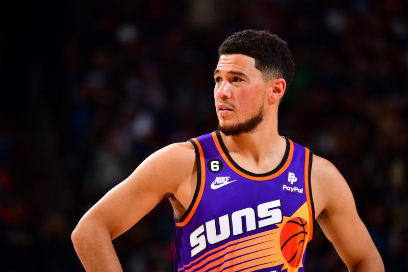 PHOENIX, AZ - OCTOBER 28: Devin Booker #1 of the Phoenix Suns looks on during the game against the New Orleans Pelicans on October 28, 2022 at Footprint Center in Phoenix, Arizona. NOTE TO USER: User expressly acknowledges and agrees that, by downloading and or using this photograph, user is consenting to the terms and conditions of the Getty Images License Agreement. Mandatory Copyright Notice: Copyright 2022 NBAE (Photo by Barry Gossage/NBAE via Getty Images)