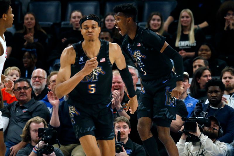 Jan 26, 2023; Memphis, Tennessee, USA; Memphis Tigers guard Keonte Kennedy (1) reacts after a dunk during the second half against the Southern Methodist Mustangs at FedExForum. Mandatory Credit: Petre Thomas-USA TODAY Sports