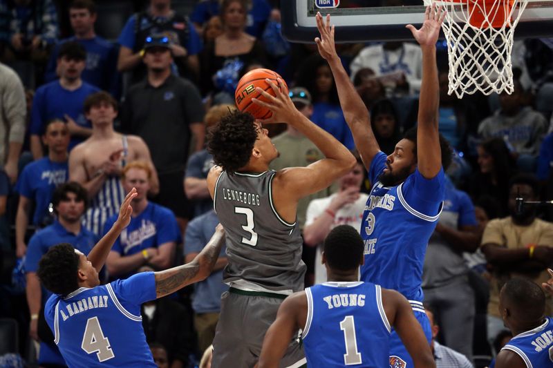 Mar 3, 2024; Memphis, Tennessee, USA; UAB Blazers forward Yaxel Lendeborg (3) drives to the basket as Memphis Tigers center Jordan Brown (3) defends during the first half at FedExForum. Mandatory Credit: Petre Thomas-USA TODAY Sports