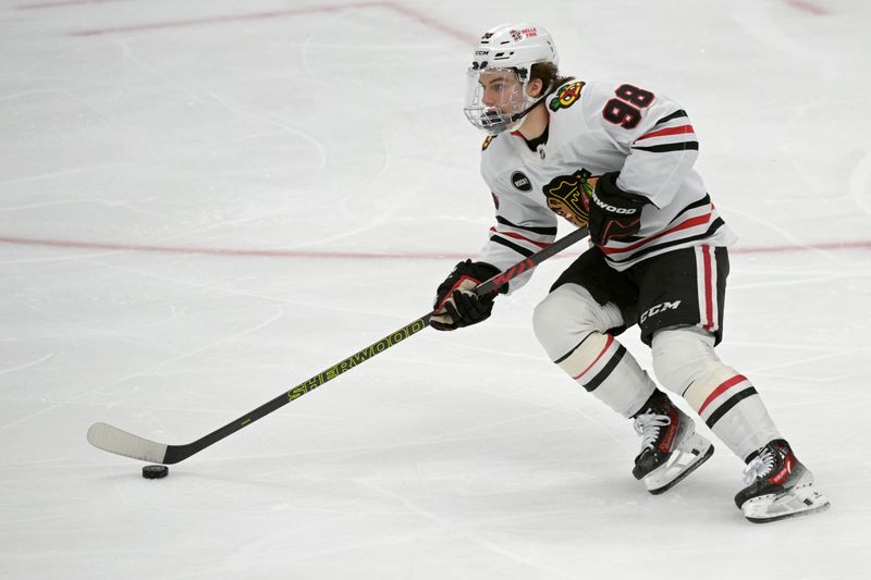 Mar 21, 2024; Anaheim, California, USA; Chicago Blackhawks center Connor Bedard (98) handles the puck in the first period against the Anaheim Ducks at Honda Center. Mandatory Credit: Jayne Kamin-Oncea-USA TODAY Sports