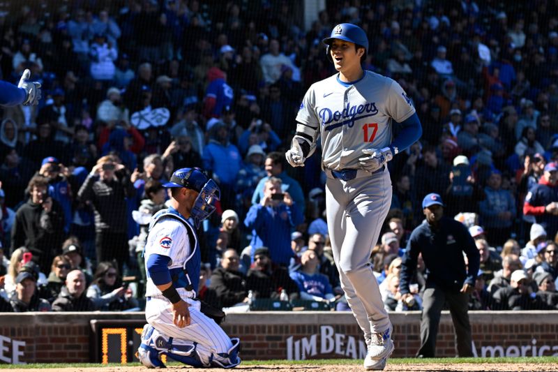 Apr 5, 2024; Chicago, Illinois, USA;  Los Angeles Dodgers two-way player Shohei Ohtani (17) crosses home plate after hitting a two-run home run against the Chicago Cubs during the fifth inning at Wrigley Field. Mandatory Credit: Matt Marton-USA TODAY Sports