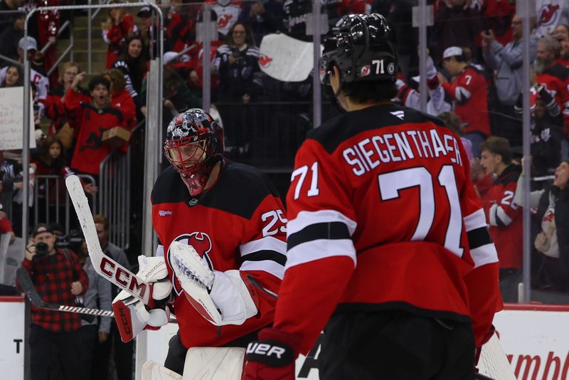 Oct 27, 2024; Newark, New Jersey, USA; New Jersey Devils goaltender Jacob Markstrom (25) celebrates their win over the against the Anaheim Ducks at Prudential Center. Mandatory Credit: Ed Mulholland-Imagn Images