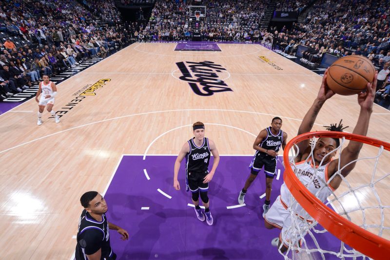 SACRAMENTO, CA - MARCH 7: Devin Vassell #24 of the San Antonio Spurs dunks the ball during the game against the Sacramento Kings on March 7, 2024 at Golden 1 Center in Sacramento, California. NOTE TO USER: User expressly acknowledges and agrees that, by downloading and or using this Photograph, user is consenting to the terms and conditions of the Getty Images License Agreement. Mandatory Copyright Notice: Copyright 2024 NBAE (Photo by Rocky Widner/NBAE via Getty Images)