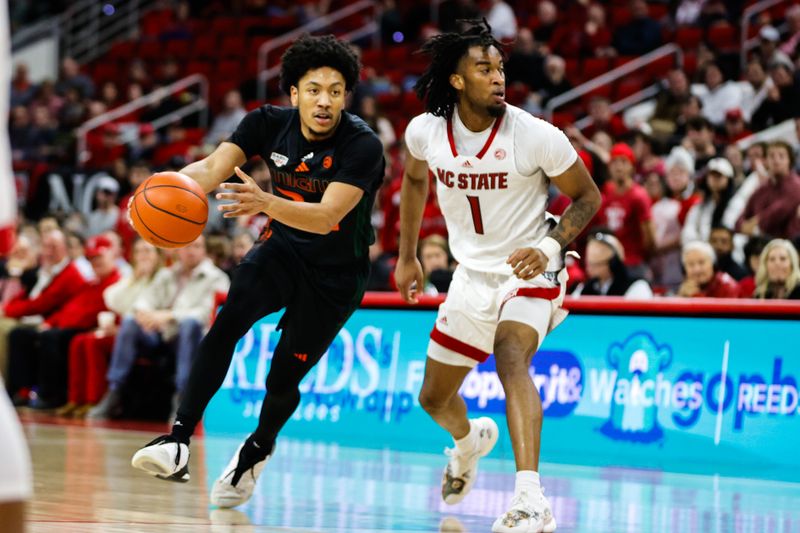 Jan 30, 2024; Raleigh, North Carolina, USA; Miami (Fl) Hurricanes guard Nijel Pack (24) dribbles with the ball during the second half against North Carolina State Wolfpack at PNC Arena. Mandatory Credit: Jaylynn Nash-USA TODAY Sports