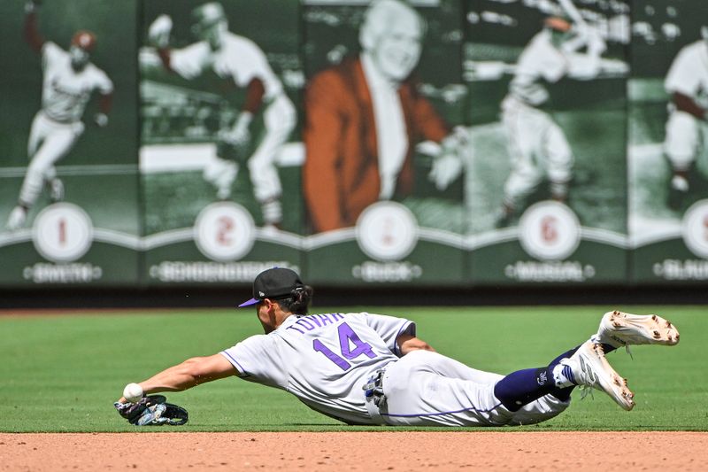 Aug 6, 2023; St. Louis, Missouri, USA;  Colorado Rockies shortstop Ezequiel Tovar (14) dives but is unable to field a ground ball against the St. Louis Cardinals during the sixth inning at Busch Stadium. Mandatory Credit: Jeff Curry-USA TODAY Sports