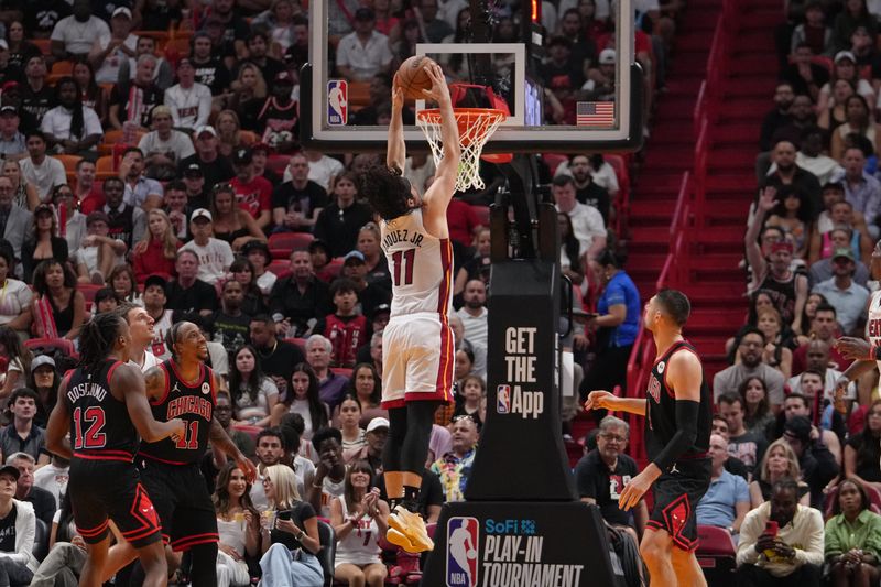 MIAMI, FL - APRIL 19: Jaime Jaquez Jr. #11 of the Miami Heat dunks the ball during the game against the Chicago Bulls during the 2024 SoFi Play-In Tournament on April 19, 2024 at Kaseya Center in Miami, Florida. NOTE TO USER: User expressly acknowledges and agrees that, by downloading and or using this Photograph, user is consenting to the terms and conditions of the Getty Images License Agreement. Mandatory Copyright Notice: Copyright 2024 NBAE (Photo by Eric Espada/NBAE via Getty Images)