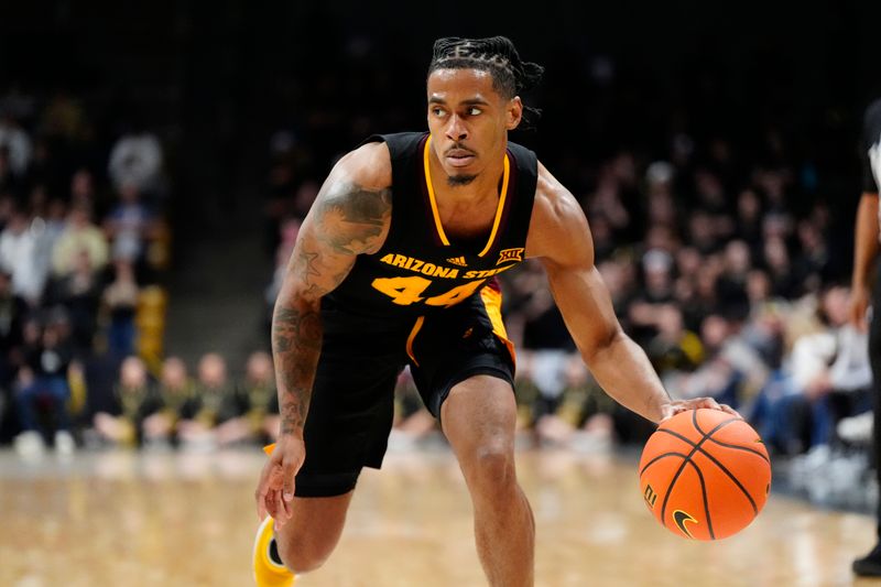 Jan 28, 2025; Boulder, Colorado, USA; Arizona State Sun Devils guard Adam Miller (44) controls the ball in the first half against the Colorado Buffaloes at CU Events Center. Mandatory Credit: Ron Chenoy-Imagn Images