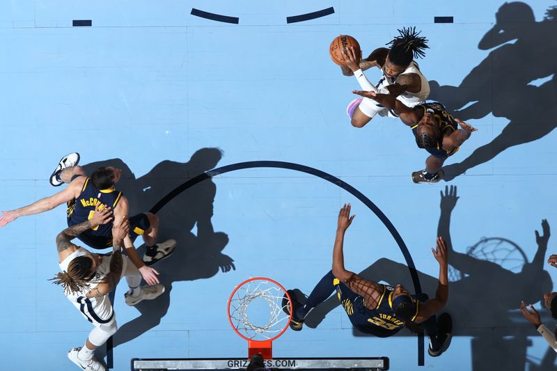 MEMPHIS, TN - JANUARY 29: Ja Morant #12 of the Memphis Grizzlies drives to the basket during the game against the Indiana Pacers on January 29, 2023 at FedExForum in Memphis, Tennessee. NOTE TO USER: User expressly acknowledges and agrees that, by downloading and or using this photograph, User is consenting to the terms and conditions of the Getty Images License Agreement. Mandatory Copyright Notice: Copyright 2023 NBAE (Photo by Joe Murphy/NBAE via Getty Images)