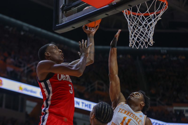 Jan 6, 2024; Knoxville, Tennessee, USA; Mississippi Rebels forward Jamarion Sharp (3) goes to the basket against Tennessee Volunteers forward Tobe Awaka (11) during the second half at Thompson-Boling Arena at Food City Center. Mandatory Credit: Randy Sartin-USA TODAY Sports