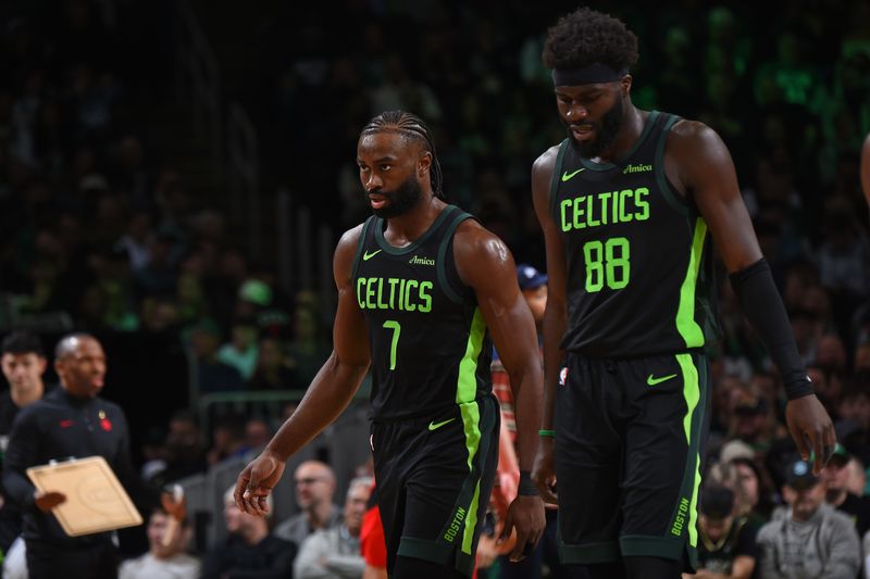 BOSTON, MA - NOVEMBER 16: Jaylen Brown #7 and Neemias Queta #88 of the Boston Celtics look on during the game against the Toronto Raptors on November 16, 2024 at TD Garden in Boston, Massachusetts. NOTE TO USER: User expressly acknowledges and agrees that, by downloading and/or using this Photograph, user is consenting to the terms and conditions of the Getty Images License Agreement. Mandatory Copyright Notice: Copyright 2024 NBAE (Photo by Brian Babineau/NBAE via Getty Images)