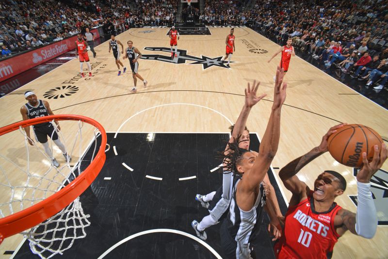 SAN ANTONIO, TX - MARCH 12: Jabari Smith Jr. #10 of the Houston Rockets drives to the basket during the game against the San Antonio Spurs on March 12, 2024 at the Frost Bank Center in San Antonio, Texas. NOTE TO USER: User expressly acknowledges and agrees that, by downloading and or using this photograph, user is consenting to the terms and conditions of the Getty Images License Agreement. Mandatory Copyright Notice: Copyright 2024 NBAE (Photos by Jesse D. Garrabrant/NBAE via Getty Images)