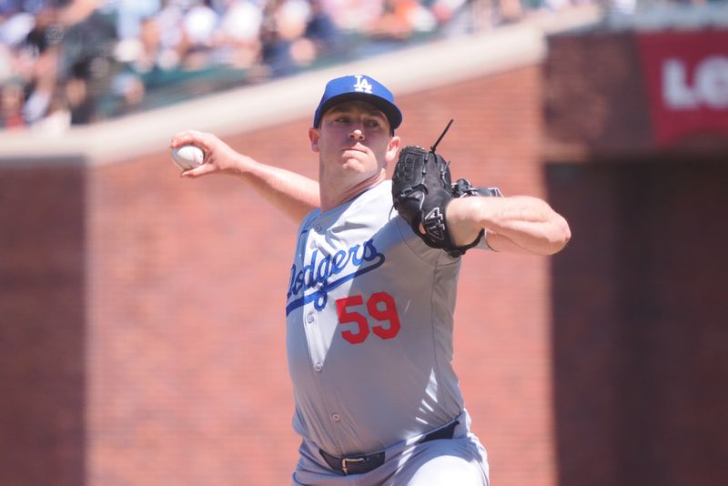 Jun 30, 2024; San Francisco, California, USA; Los Angeles Dodgers relief pitcher Evan Phillips (59) pitches the ball against the San Francisco Giants during the eighth inning at Oracle Park. Mandatory Credit: Kelley L Cox-USA TODAY Sports