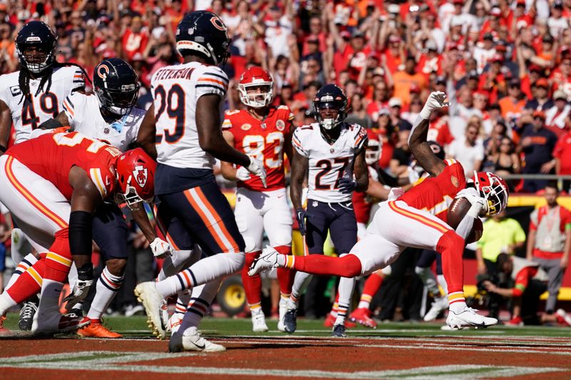 Kansas City Chiefs running back Jerick McKinnon scores during the first half of an NFL football game against the Chicago Bears Sunday, Sept. 24, 2023, in Kansas City, Mo. (AP Photo/Ed Zurga)