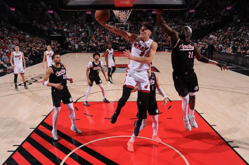 PORTLAND, OR - JANUARY 11: Pelle Larsson #9 of the Miami Heat shoots the ball during the game against the Portland Trail Blazers  on January 11, 2025 at the Moda Center Arena in Portland, Oregon. NOTE TO USER: User expressly acknowledges and agrees that, by downloading and or using this photograph, user is consenting to the terms and conditions of the Getty Images License Agreement. Mandatory Copyright Notice: Copyright 2025 NBAE (Photo by Cameron Browne/NBAE via Getty Images)