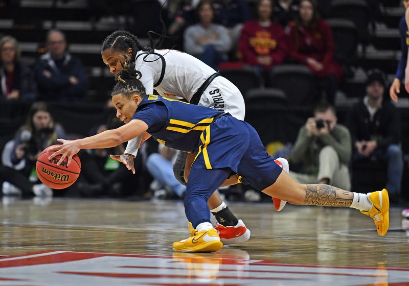 Mar 10, 2023; Kansas City, MO, USA;  West Virginia Mountaineers guard JJ Quinerly (11) dives after the ball against Oklahoma State Cowgirls guard Naomie Alnatas (3) during the first half at Municipal Auditorium. Mandatory Credit: Peter Aiken-USA TODAY Sports