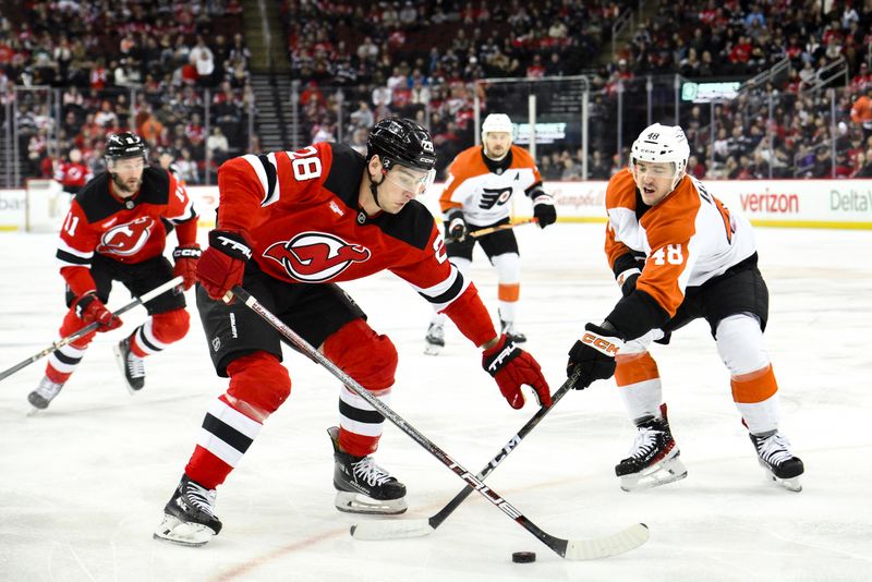 Jan 29, 2025; Newark, New Jersey, USA; New Jersey Devils right wing Timo Meier (28) skates with the puck against Philadelphia Flyers center Morgan Frost (48) during the first period at Prudential Center. Mandatory Credit: John Jones-Imagn Images