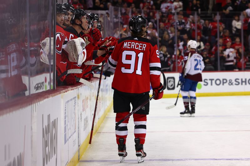 Feb 6, 2024; Newark, New Jersey, USA; New Jersey Devils center Dawson Mercer (91) celebrates his goal against the Colorado Avalanche during the second period at Prudential Center. Mandatory Credit: Ed Mulholland-USA TODAY Sports